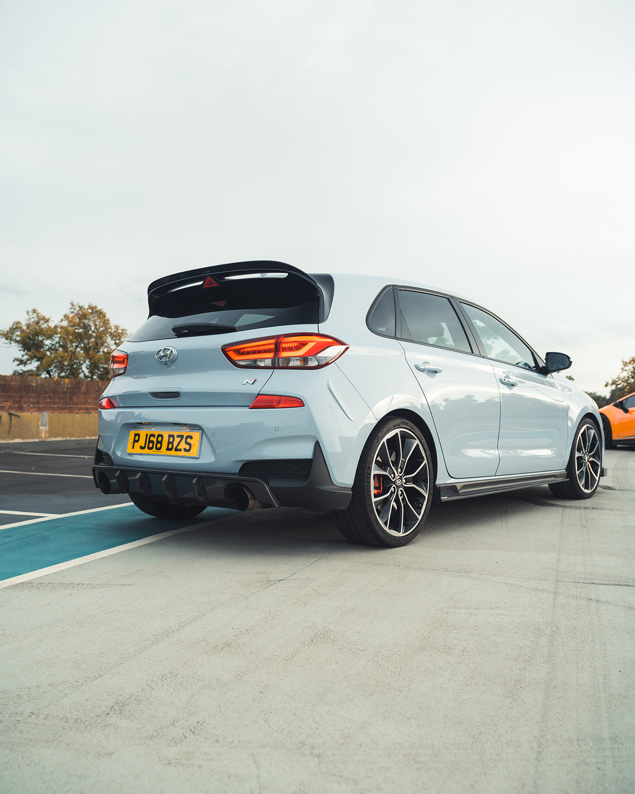 Hyundai i30N carbon fibre kit by CT Design, pre-facelift version, showing sleek carbon fibre components on a car.