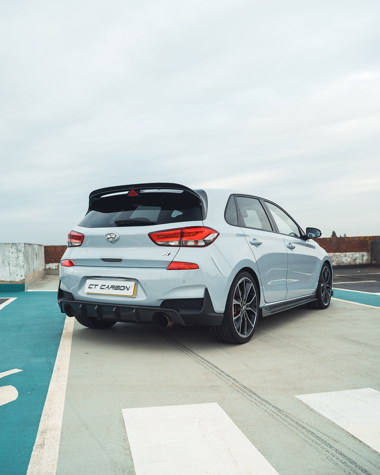 Hyundai i30N carbon fibre kit by CT Design, pre-facelift model, showing close-up of carbon fibre accents and sleek design details.
