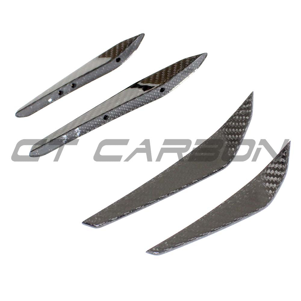 BMW M3 M4 G80 G82 carbon fibre front bumper canards by CT Carbon, showcasing aerodynamic accessories on the vehicle.