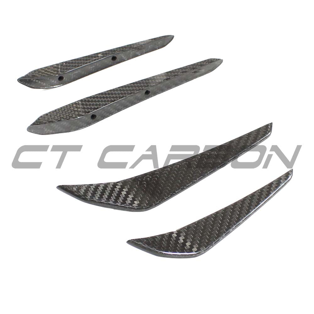 BMW M3 M4 G80 G81 G82 G83 carbon fiber front bumper canards by CT Carbon, showing sleek aerodynamic design and lightweight construction.