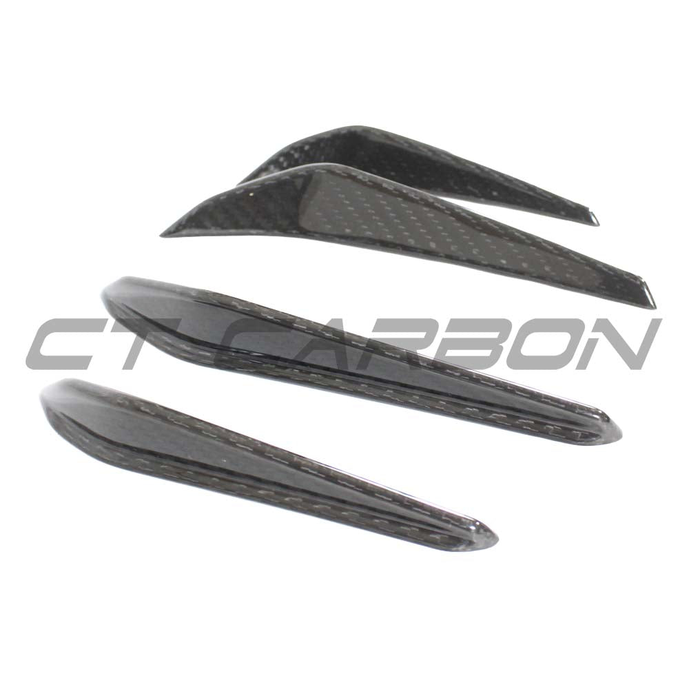BMW M3 M4 G80 G82 G83 carbon fibre front bumper canards by CT Carbon, showing close-up of aerodynamic car accessories.
