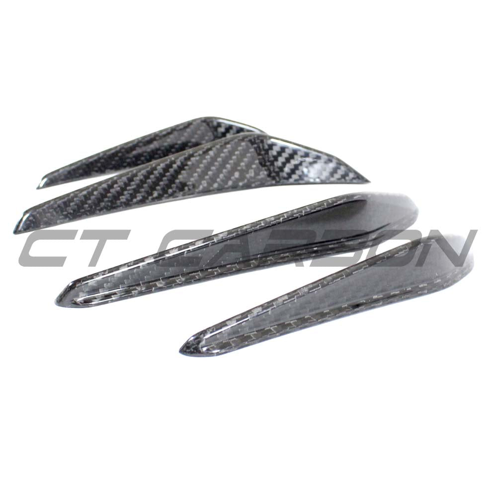 BMW M3 M4 G80 G81 G82 G83 carbon fiber front bumper canards by CT Carbon, showcasing sleek aerodynamic design.