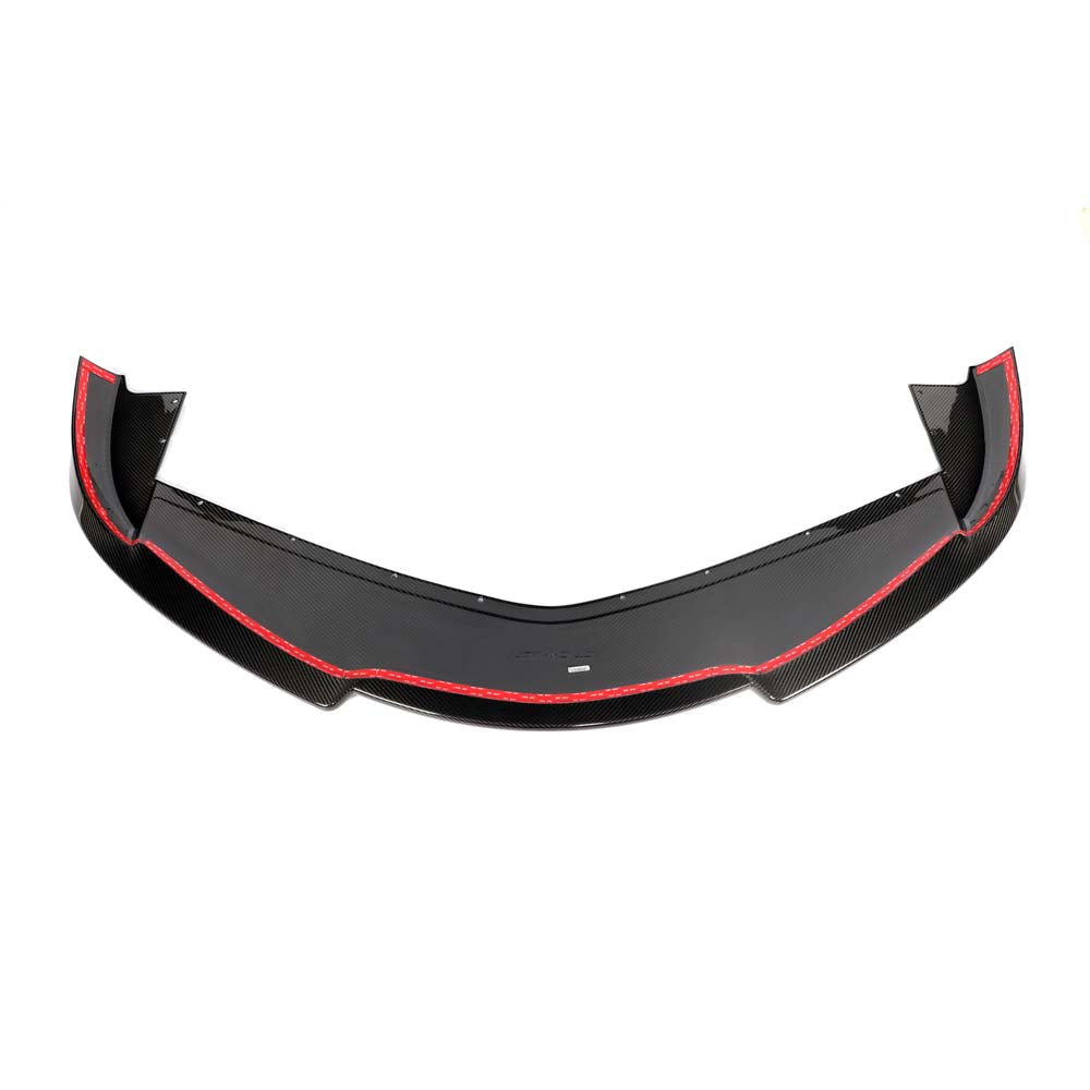Close-up of a CT Carbon McLaren Artura 2023 carbon fiber splitter showing its sleek, aerodynamic design and detailed craftsmanship.