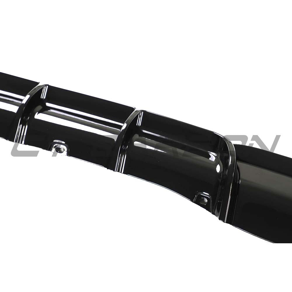 BMW 3 Series F30/F31 GLOSS BLACK left exhaust diffuser by CT Carbon, showcasing sleek, aerodynamic design for sporty appearance.
