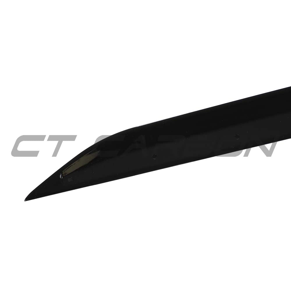 BMW 3 Series G20 G21 side skirts in gloss black by CT Carbon, showcasing sleek, aerodynamic design on a vehicle.