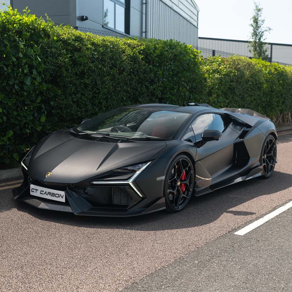 Lamborghini Revuelto full carbon fiber kit by CT Design, featuring sleek carbon fiber panels and accents on a supercar.