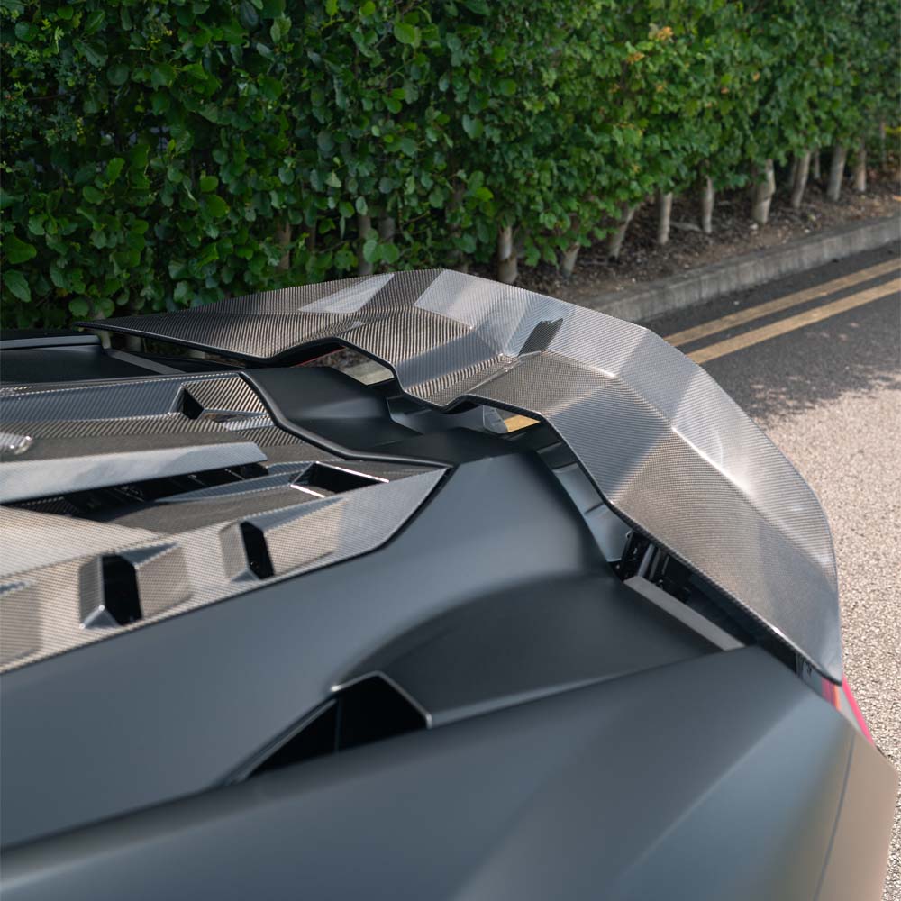 Lamborghini Revuelt full carbon fibre kit by CT Carbon, showcasing sleek carbon fiber panels on the car's exterior.