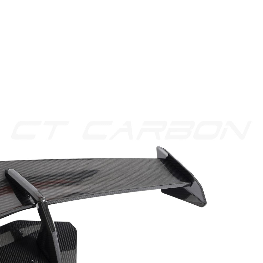 Lamborghini Huracan LP-580/LP-610 EVO carbon fiber spoiler by CT Carbon on a sleek sports car.