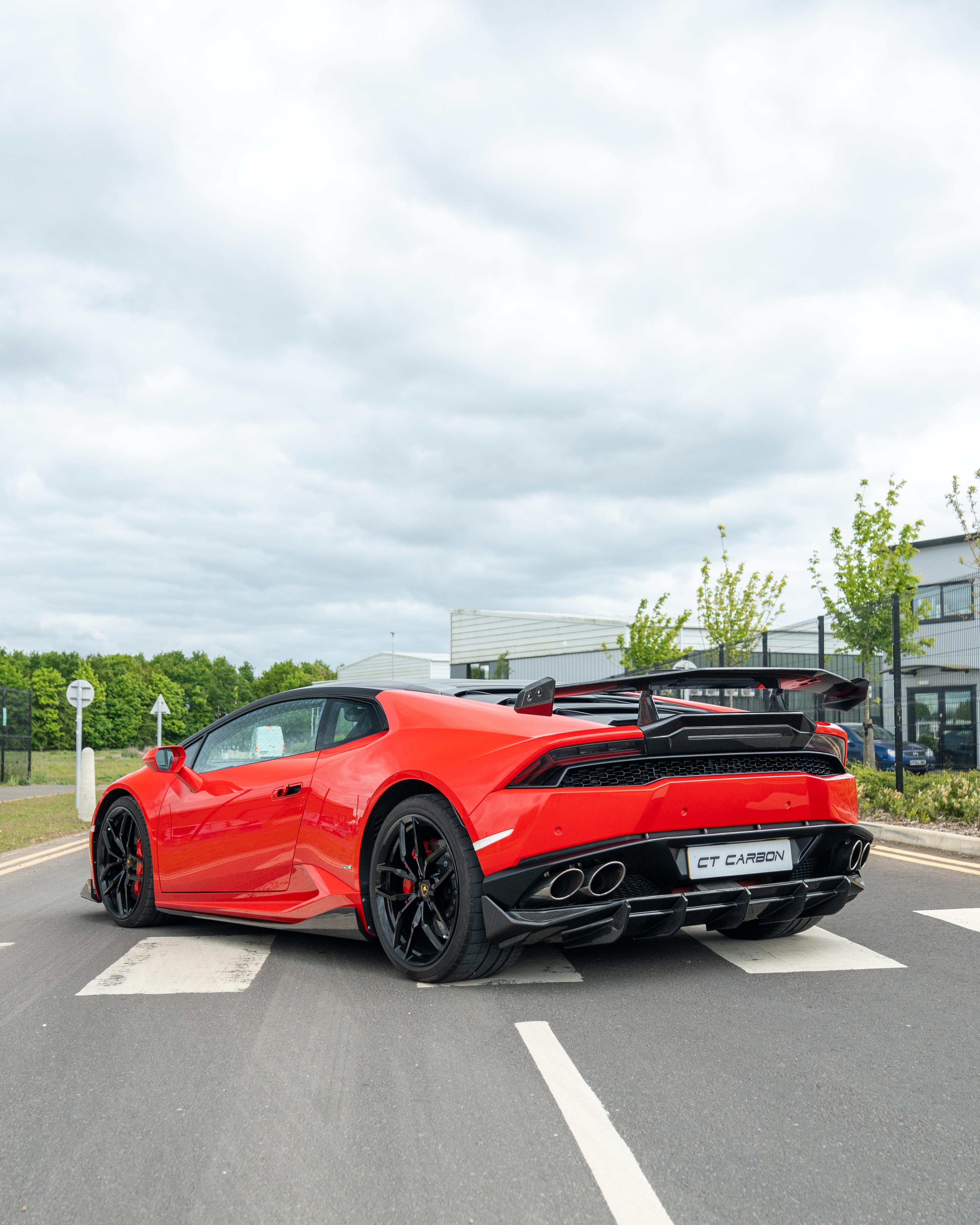 Lamborghini Huracan LP-610 carbon fiber diffuser by CT Carbon, showcasing sleek design and textured carbon fiber surface.