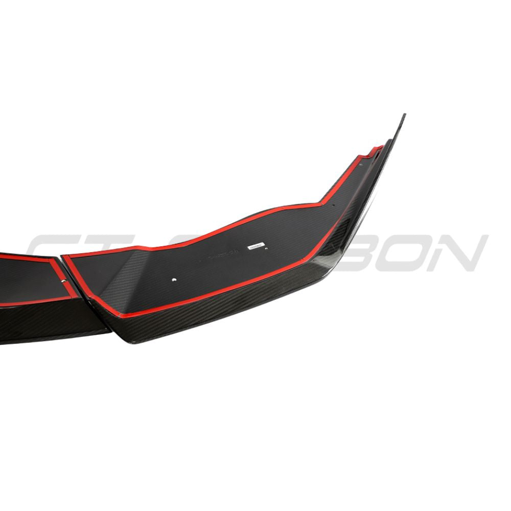 Lamborghini Huracan LP-610 carbon fiber splitter by CT Design, showing the sleek black carbon fiber surface and aerodynamic design.