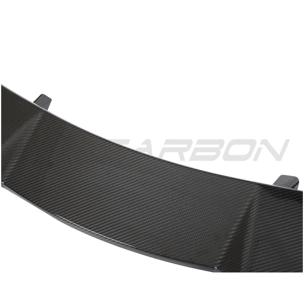 Lamborghini Urus carbon fibre roof spoiler by CT Design mounted on the vehicle with a sleek, aerodynamic design.