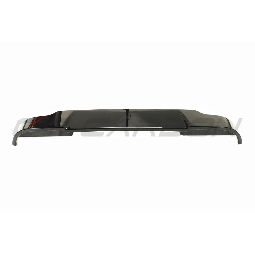 Gloss black CT Carbon spoiler for Land Rover Defender L663 90/110/130, shown installed on the vehicle in a close-up view.