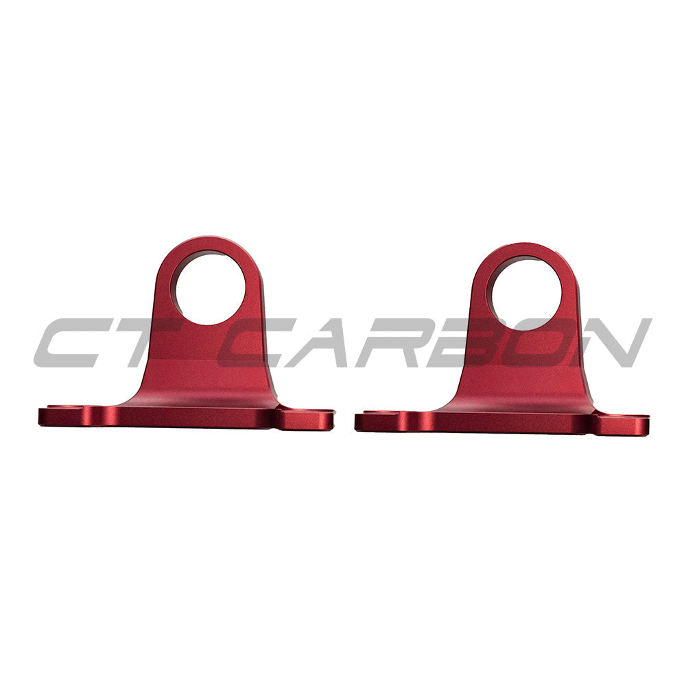 Red aluminum tow hooks for Land Rover Defender L663 90/110/130, accessories by CT Carbon, mounted on the vehicle's front or rear bumper.
