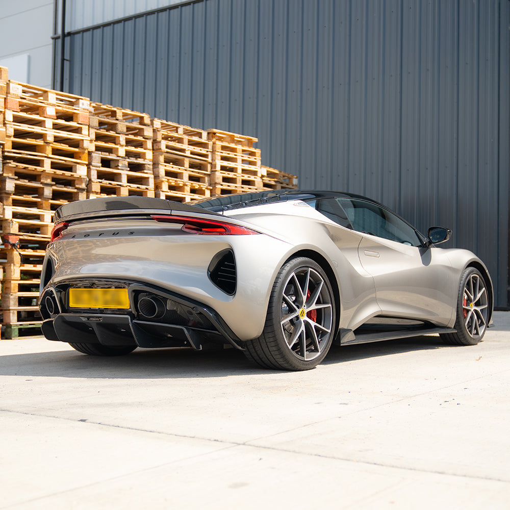 Lotus Emira full 2022+ carbon fibre kit with a three-piece spoiler by CT Design, featuring sleek, lightweight carbon fibre components.
