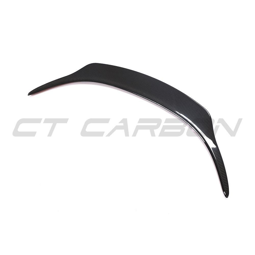 Toyota Supra 2019+ A90 CT Carbon V3 carbon fibre spoiler mounted on the car's rear, showcasing sleek aerodynamic design.