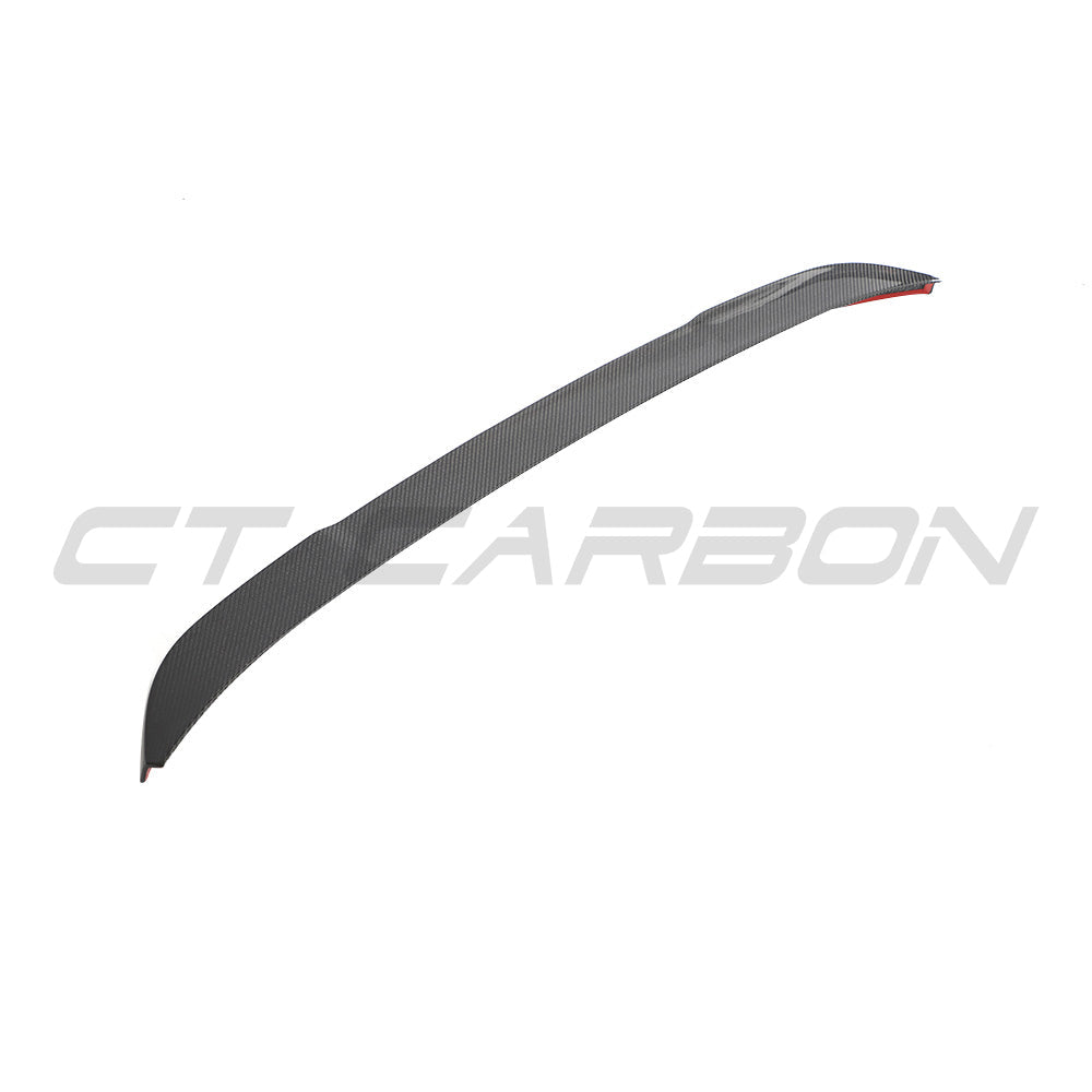 BMW G02 X4 and F98 X4M carbon fibre spoiler by CT Carbon, showcasing a sleek, aerodynamic design on the vehicle's rear.