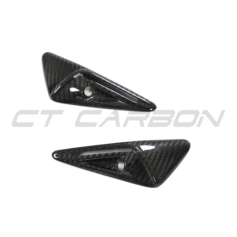 Tesla Model 3 2017-2023 carbon fiber side camera cover by CT Carbon, close-up view of the sleek, textured accessory on the vehicle.