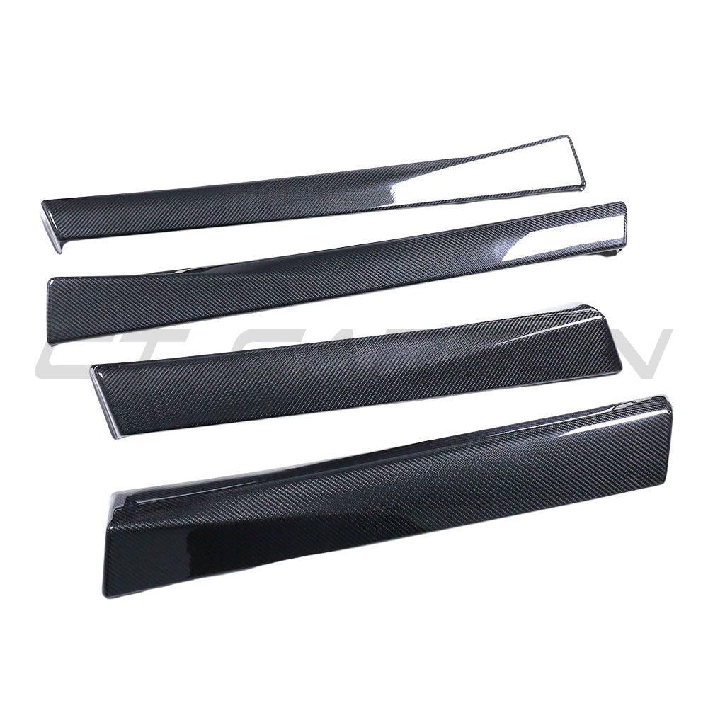 Tesla Model 3 2017-2023 carbon fiber interior door panel trim accessory by CT Carbon, showing sleek, textured surface attachment.
