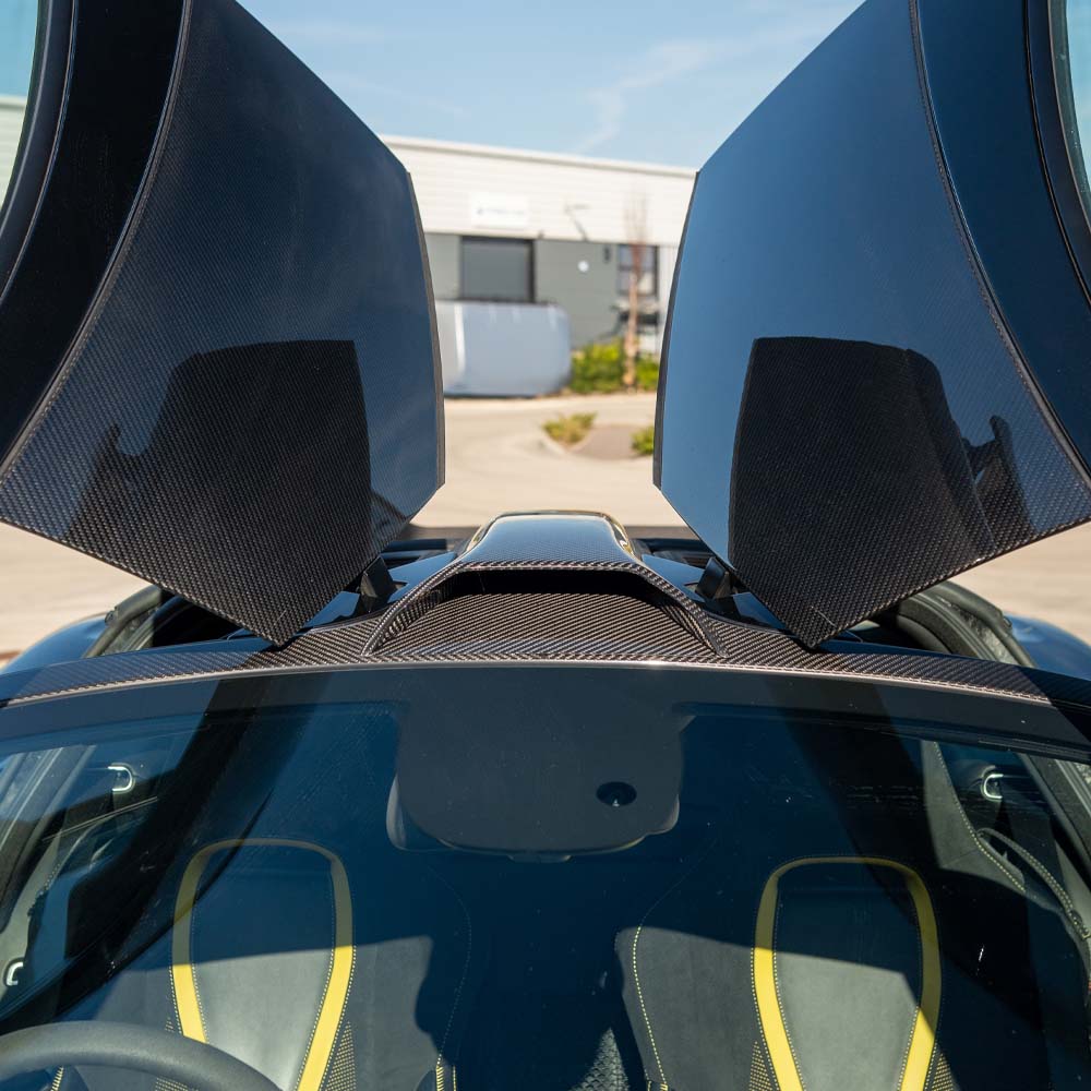 MCLAREN 720S carbon fibre roof scoop by CT Carbon, showing a sleek, lightweight automotive roof accessory on a sports car.