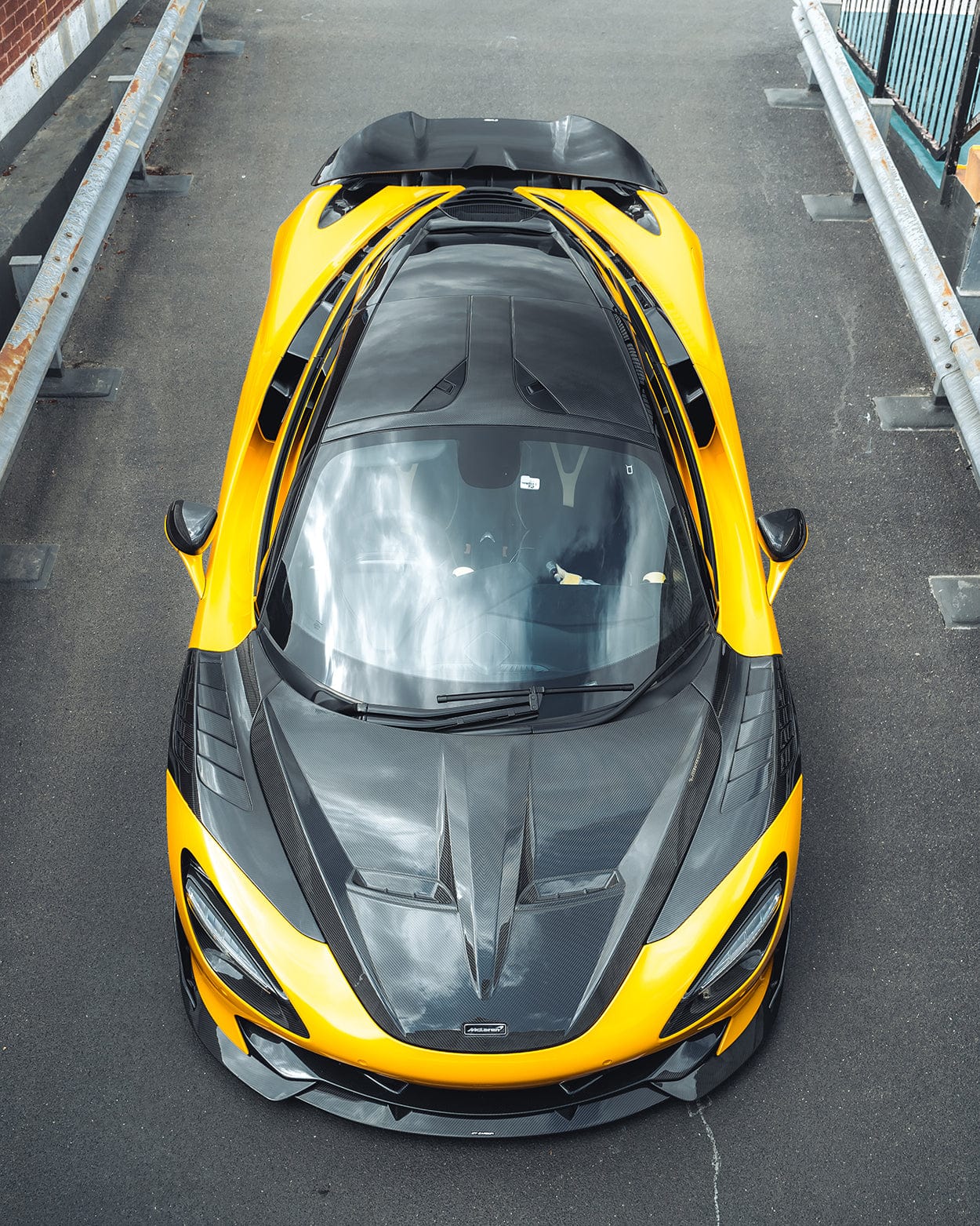 Full view of a McLaren 720S with CT Carbon full carbon fibre kit, showcasing sleek carbon fibre accents and aerodynamic design.