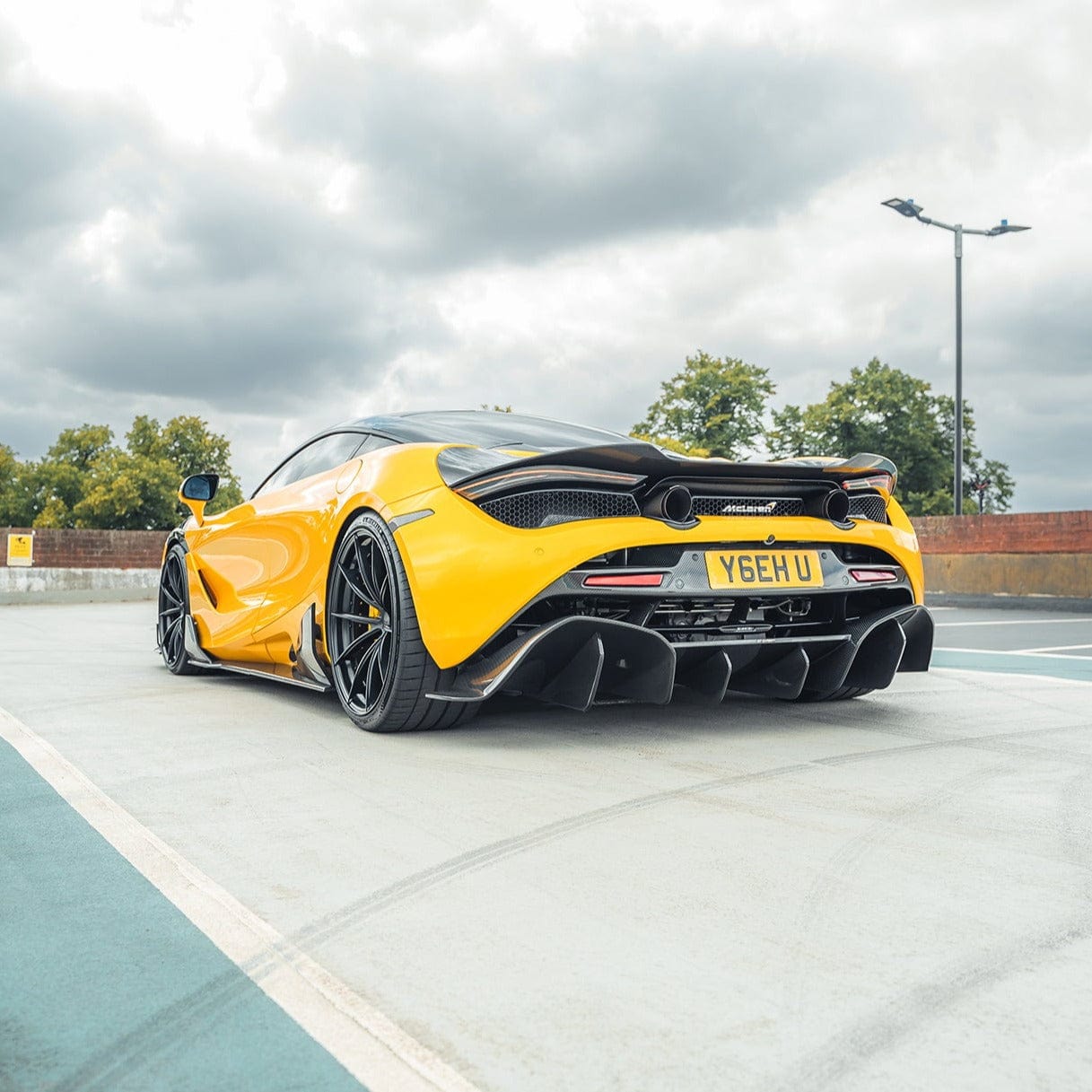 MCLAREN 720S full carbon fibre CT kit showcased on a sleek sports car with detailed carbon fibre panels and aerodynamic design.