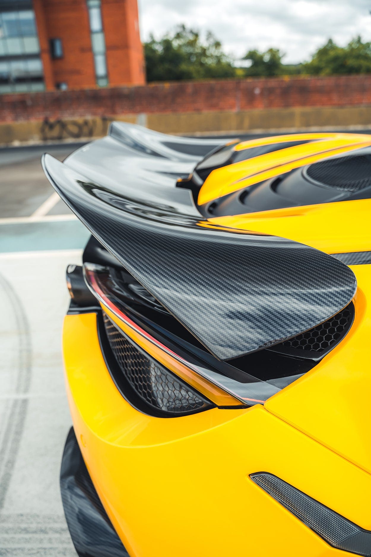 Full view of a McLaren 720S with CT Carbon V2 full carbon fiber kit, showcasing sleek carbon fiber body enhancements.