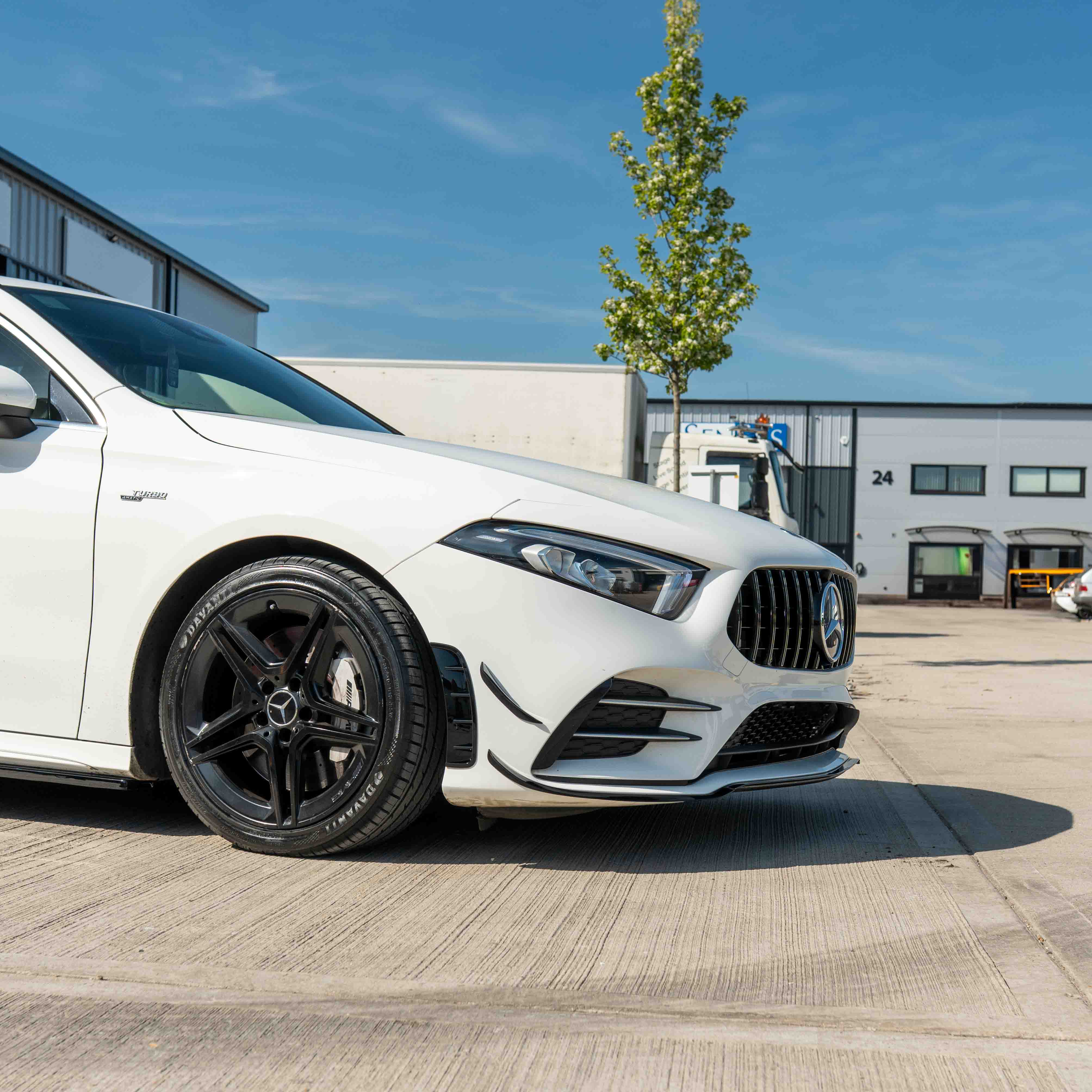 Mercedes A-Class V177 W177 2018-2022 CT Carbon gloss black splitter and canards installed on front bumper.