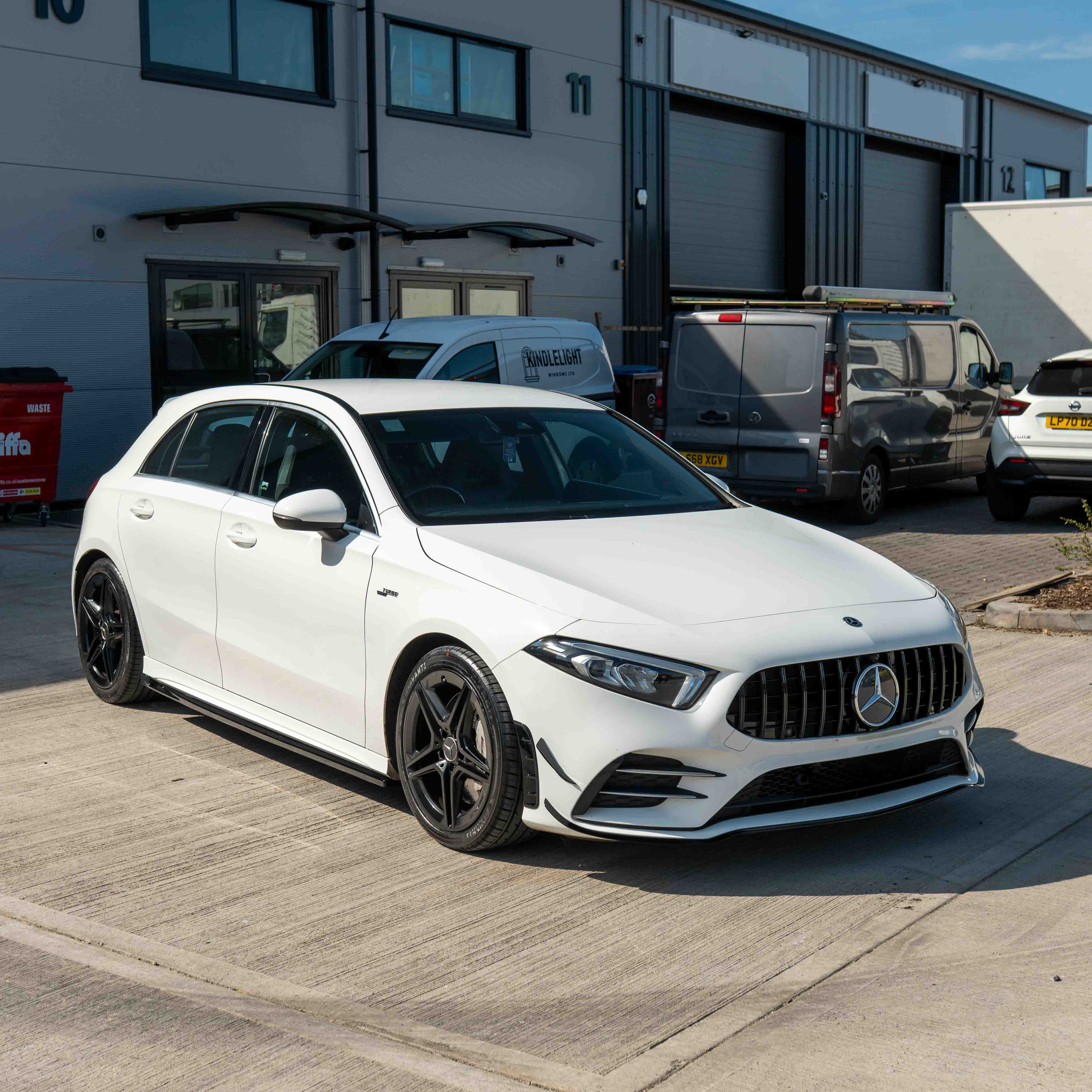 Mercedes A-Class V177 W177 2018-2022 CT Carbon gloss black splitter with canards, showing aerodynamic front bumper enhancement.
