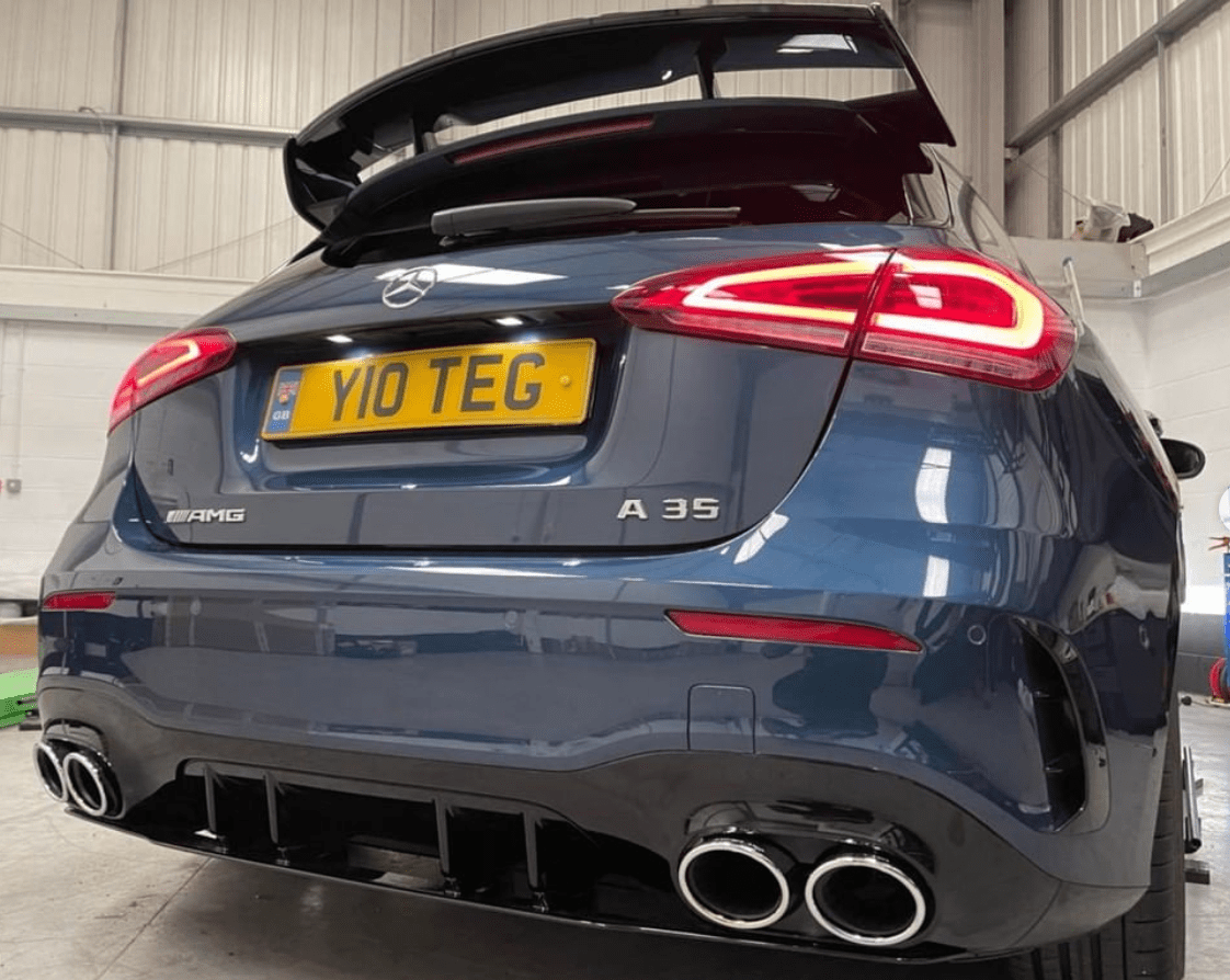 Mercedes A-Class W177 2018-current CT Carbon gloss black spoiler wing mounted on the vehicle's rear.
