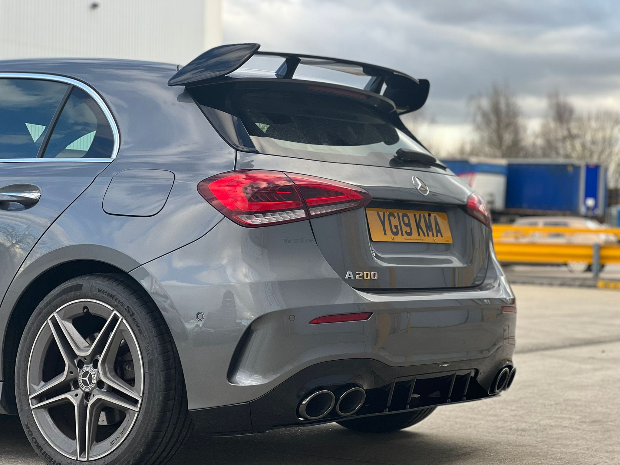 Mercedes A-Class W177 2018-current gloss black CT Carbon spoiler wing installed on the rear of the vehicle.