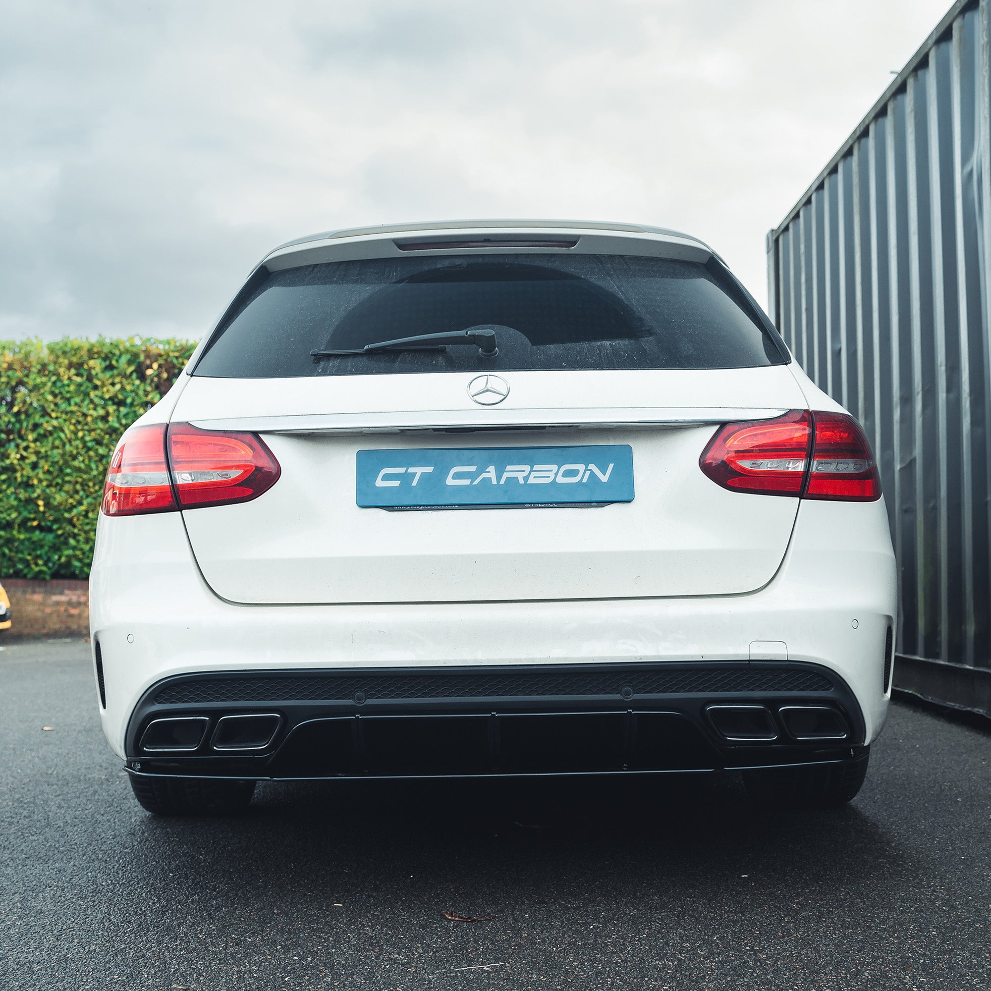 Mercedes C-Class W205 saloon and estate gloss black diffuser with black tips by CT Carbon, showing the sleek rear design.