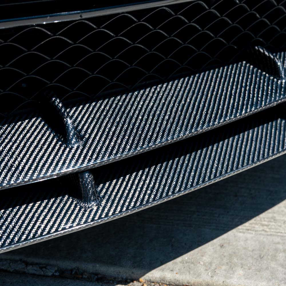 Mercedes C63 W205 coupe carbon fiber splitter V2 by CT Carbon, shown installed on the front bumper of the sporty coupe.