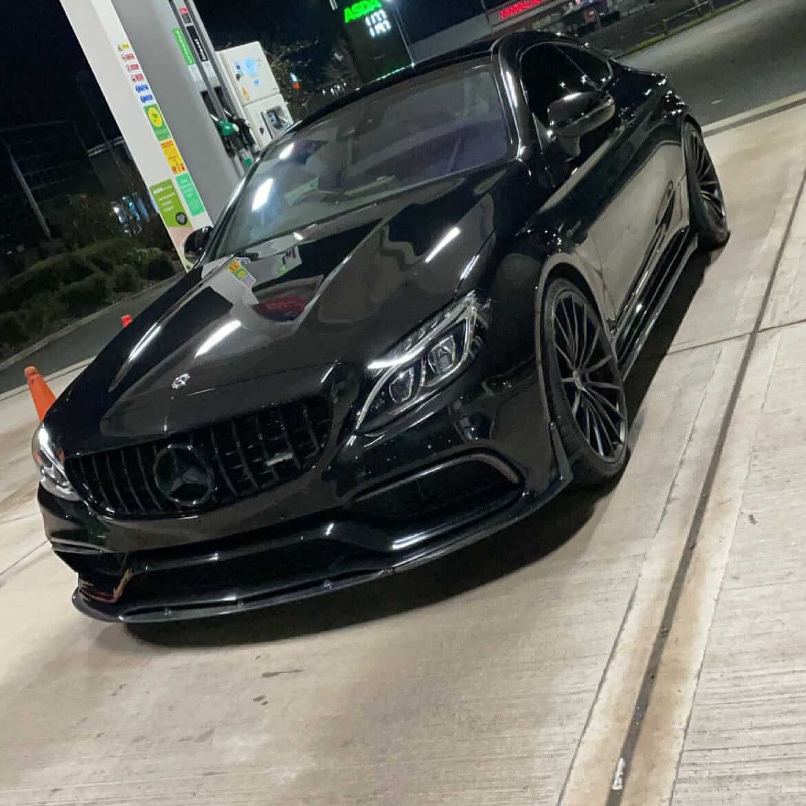 Mercedes C63 W205 coupe convertible carbon splitter by CT Carbon, ED1 style, mounted on front bumper for sporty look.