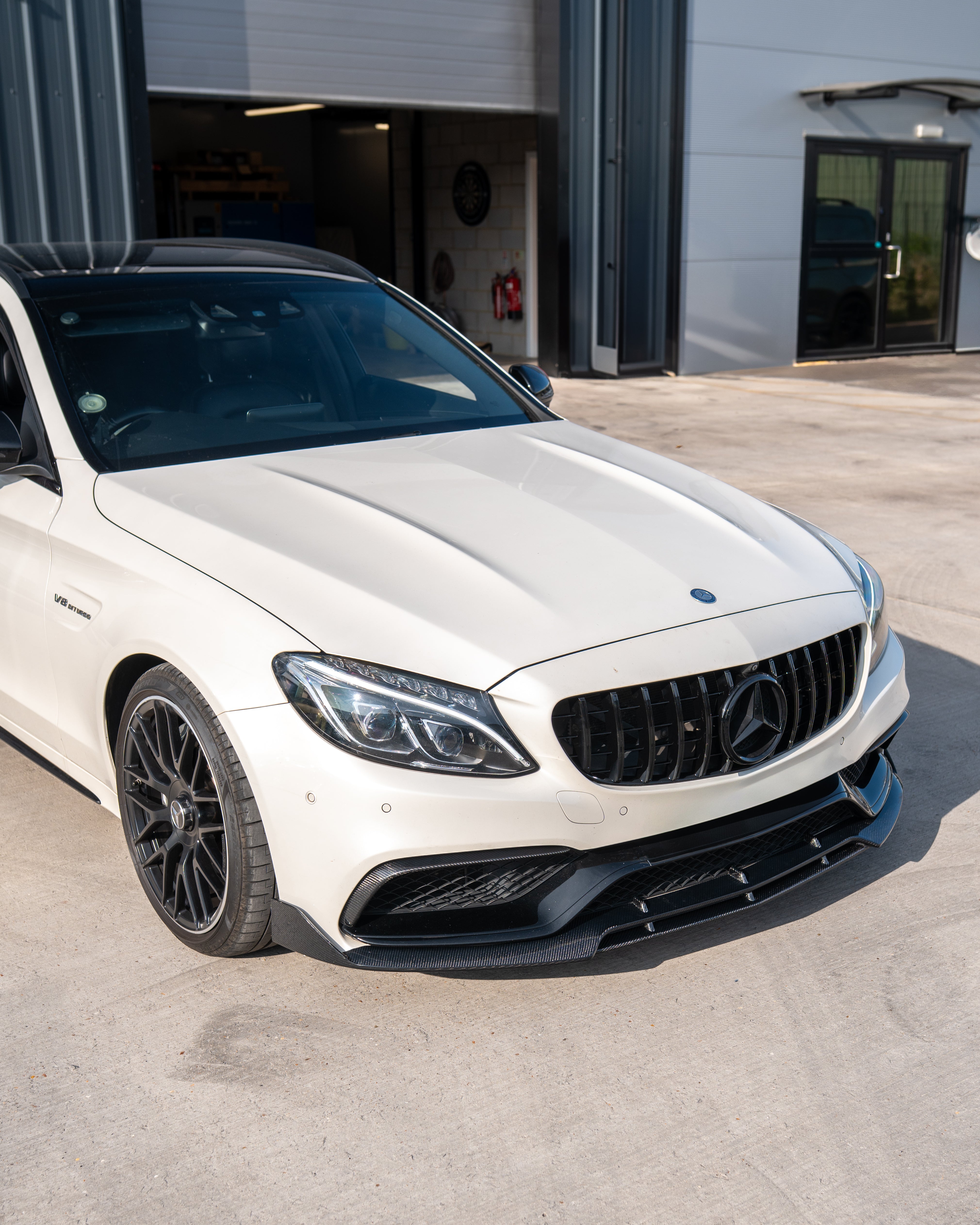 Mercedes W205 C63 AMG 2014-2018 grille with camera by CT Carbon, featuring black carbon fiber finish and AMG GT styling.