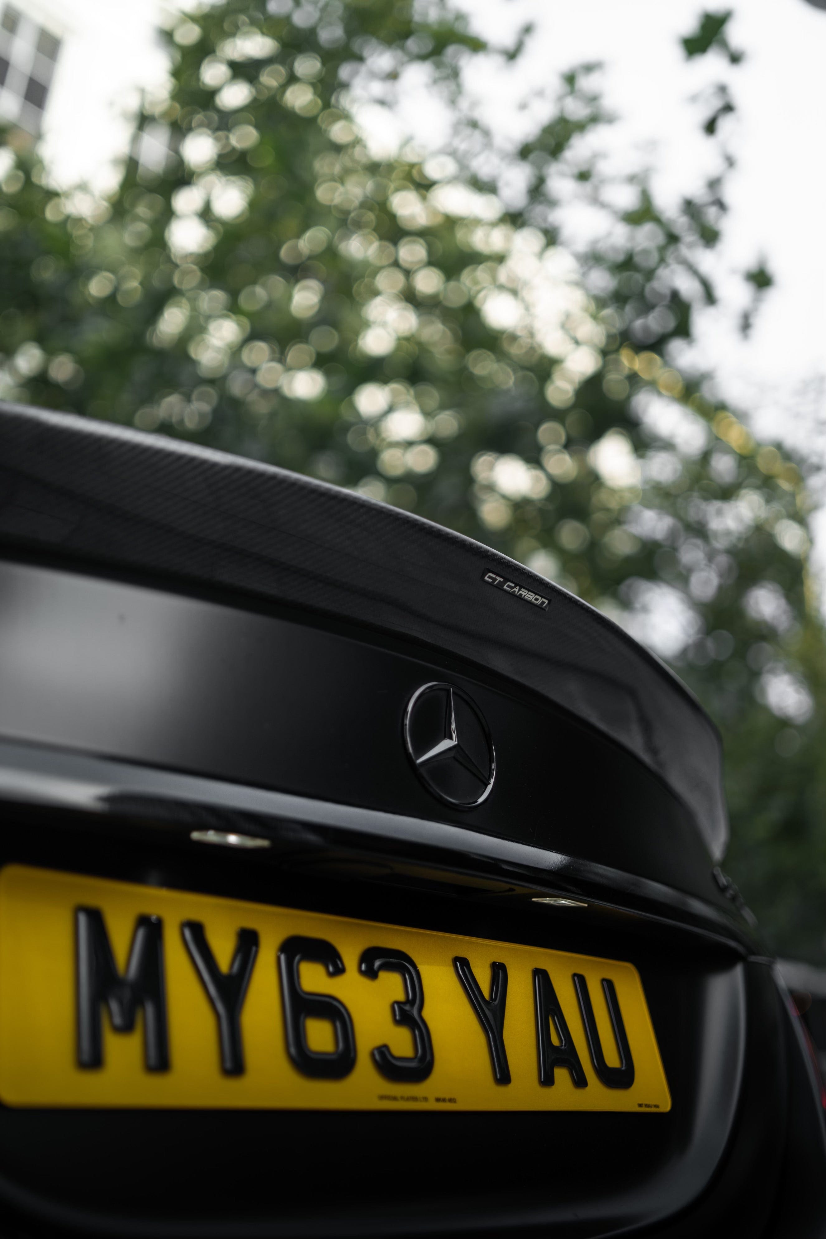 Mercedes C63/C63S W205 saloon carbon spoiler, V1 ducktail style by CT Carbon, mounted on the rear of the sports car.