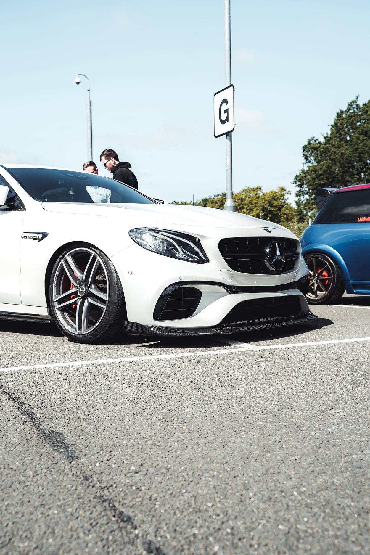 Mercedes E63 W213 2018-2020 CT Design carbon fiber splitter installed on front bumper, showcasing sleek, lightweight performance upgrade.