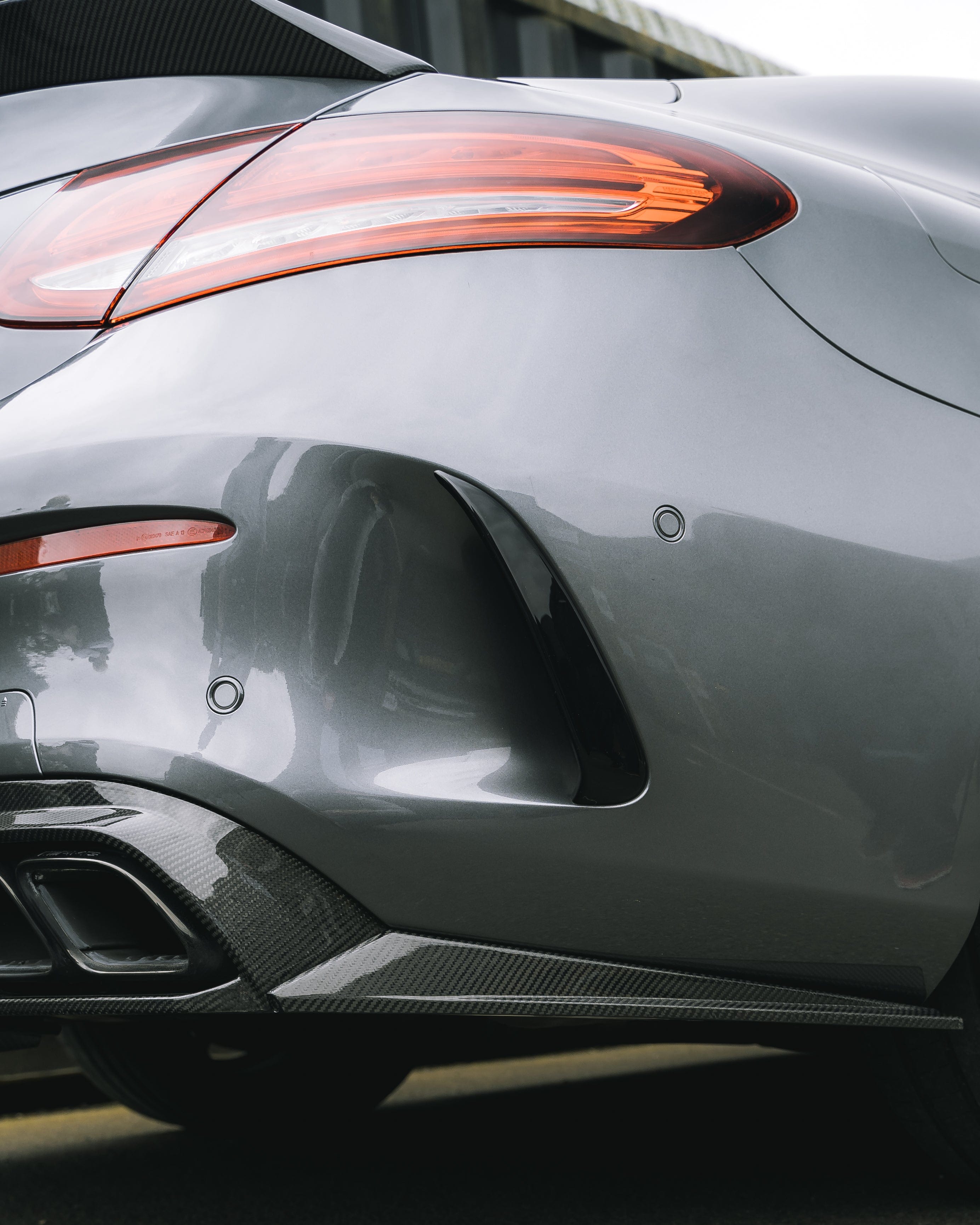 Carbon fiber diffuser for Mercedes W205 C63 facelift coupe and convertible by CT Carbon, showcasing sleek automotive design.