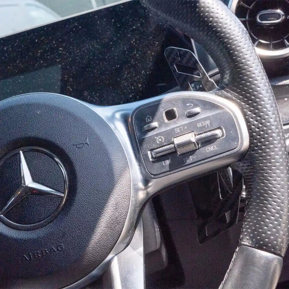 Mercedes AMG magnetic carbon fiber shifter paddles by CT Carbon, featuring sleek black carbon fiber design for sporty interior accents.