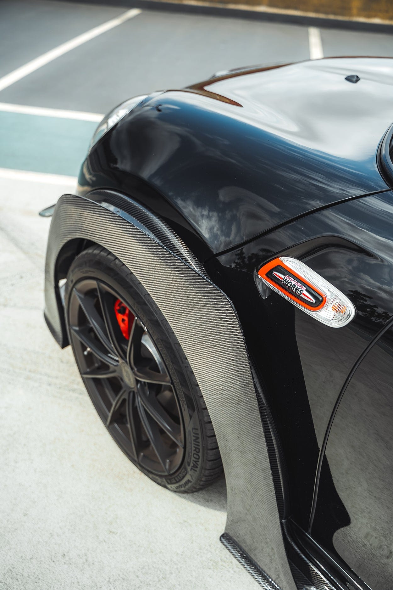 Carbon fiber wide arch kit for MINI Cooper S F56 JCW Sport Pack by CT Carbon, showcasing sleek, aerodynamic design and precise fit.