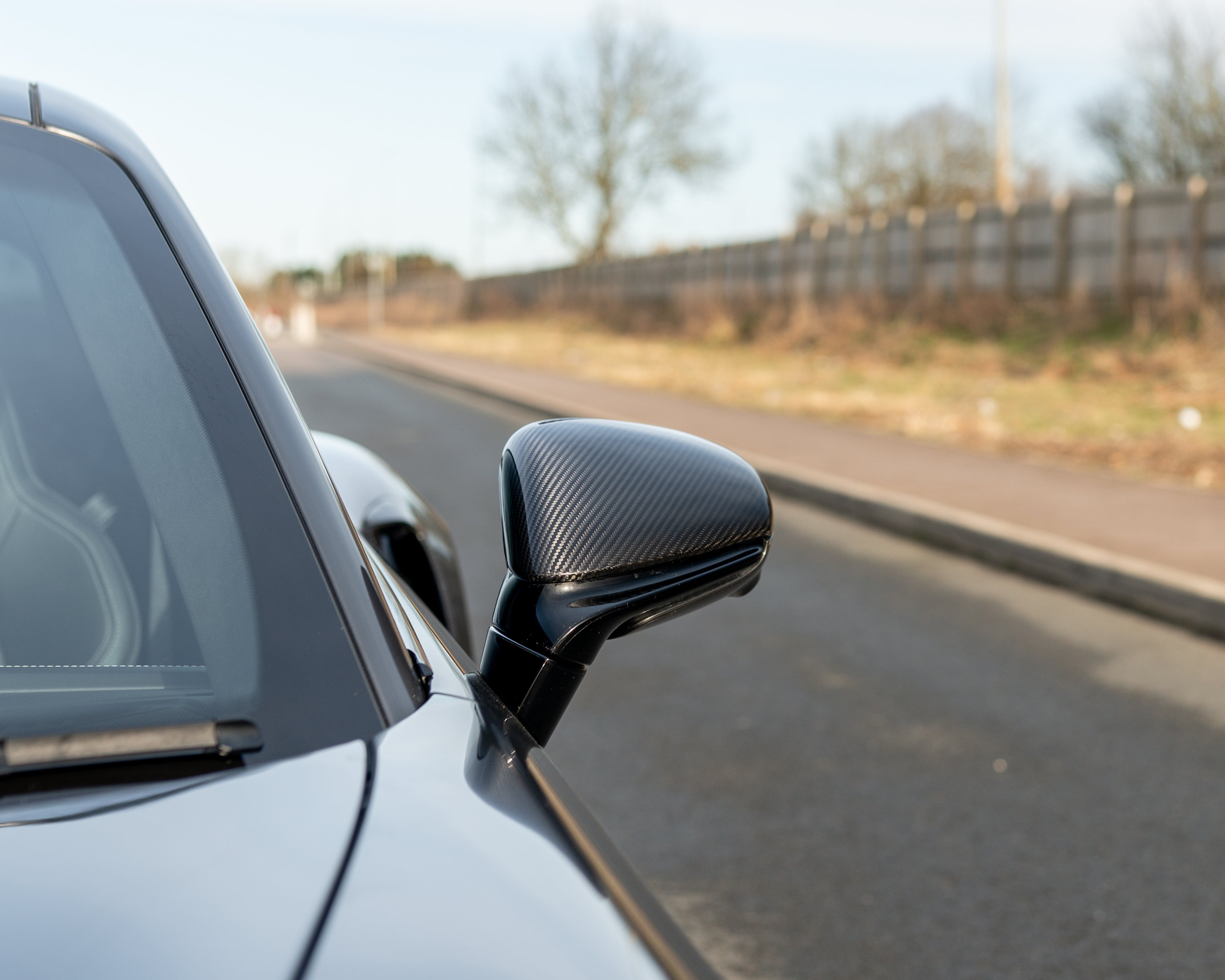 Porsche 911 992 carbon fibre side mirrors for right-hand drive, CT Carbon accessories, close-up view of sleek, lightweight design.
