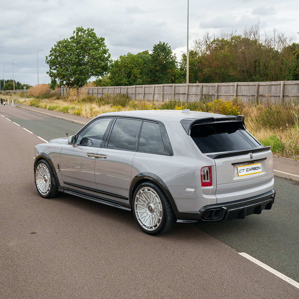 Rolls Royce Cullinan carbon fibre side skirts splitter by CT Carbon, showcasing sleek, glossy black automotive enhancement.