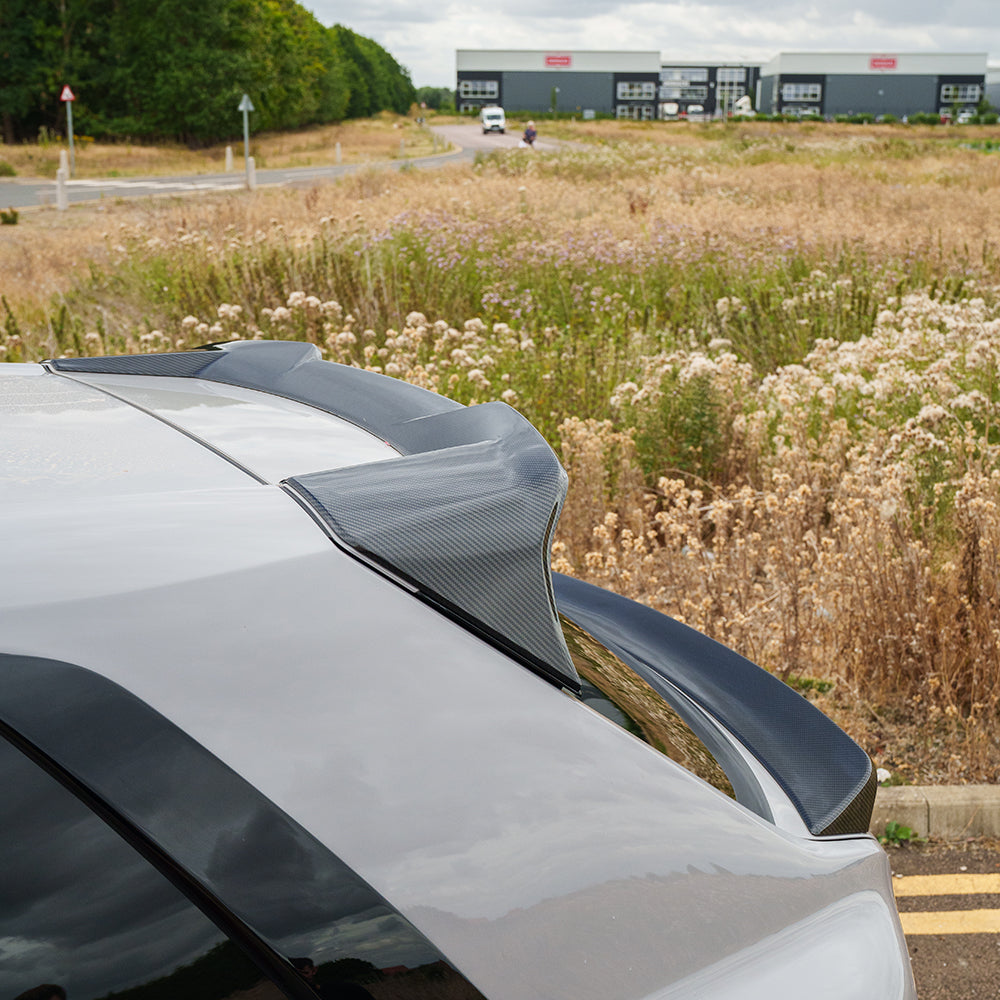 Rolls Royce Cullinan full carbon fibre roof spoiler kit by CT Design, shown on the luxury SUV with detailed carbon fiber finish.