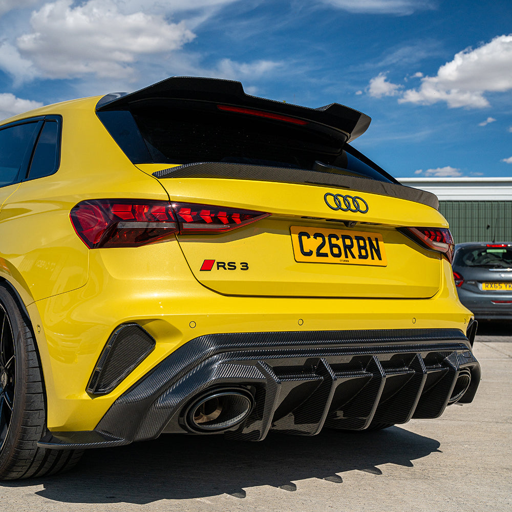 Audi RS3 8Y Sportback 2025+ carbon fibre rear diffuser by CT Carbon, showcasing sleek, textured carbon fiber design on the vehicle.