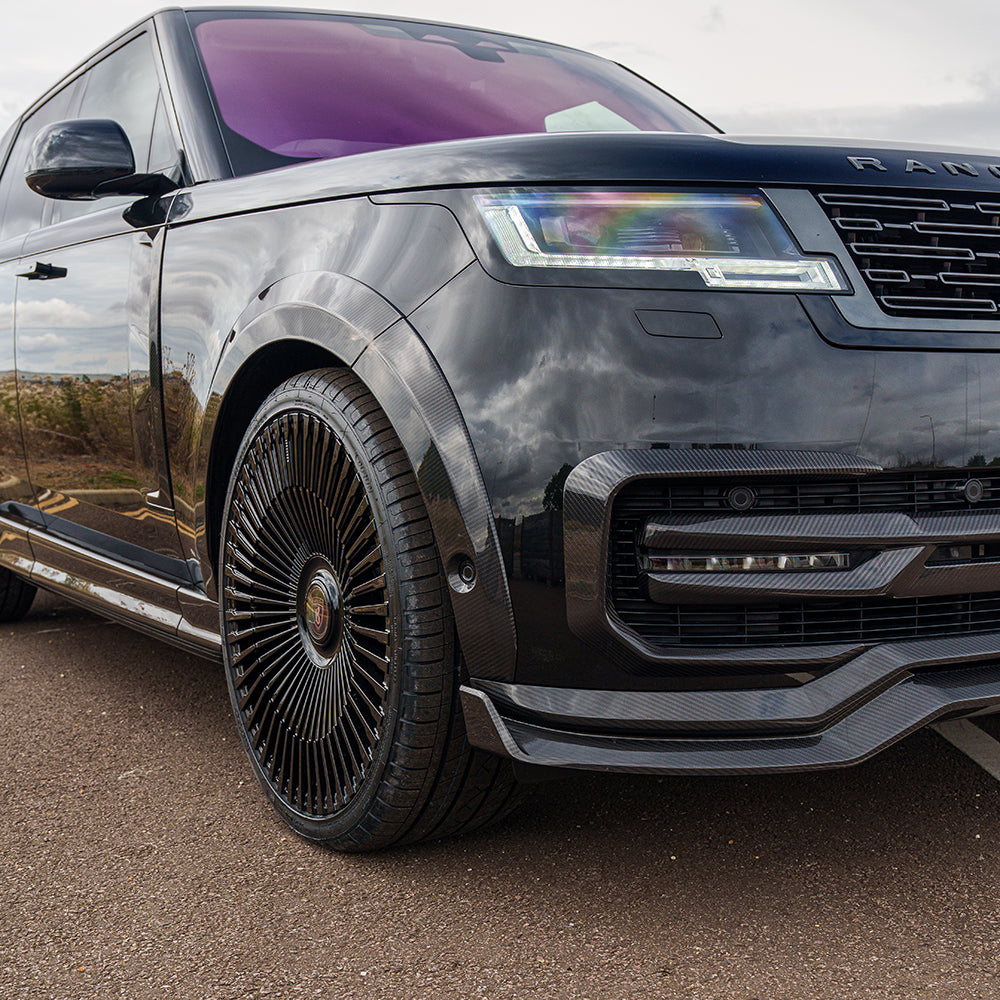 Range Rover L460 2022+ CT Carbon fiber splitter, aerodynamic car accessory, mounted on front bumper for enhanced performance.