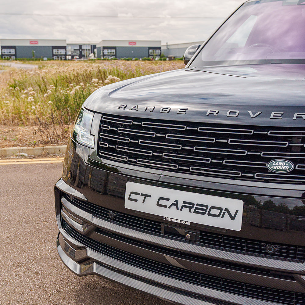 Range Rover L460 2022+ carbon fibre splitter by CT Carbon, showcasing sleek, aerodynamic design on the front of the vehicle.