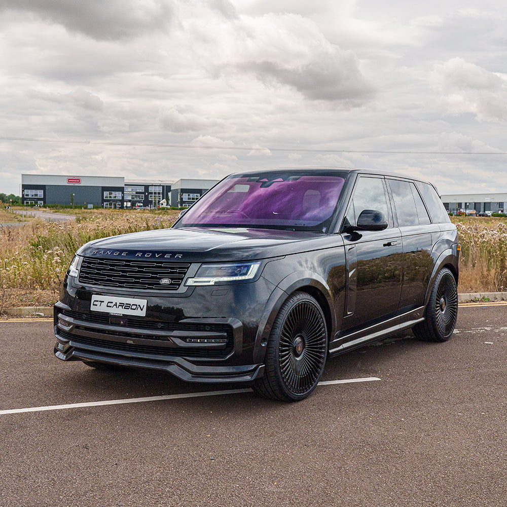 Range Rover L460 2022+ carbon fibre roof spoiler by CT Carbon, sleek aerodynamic design on the vehicle's roof.