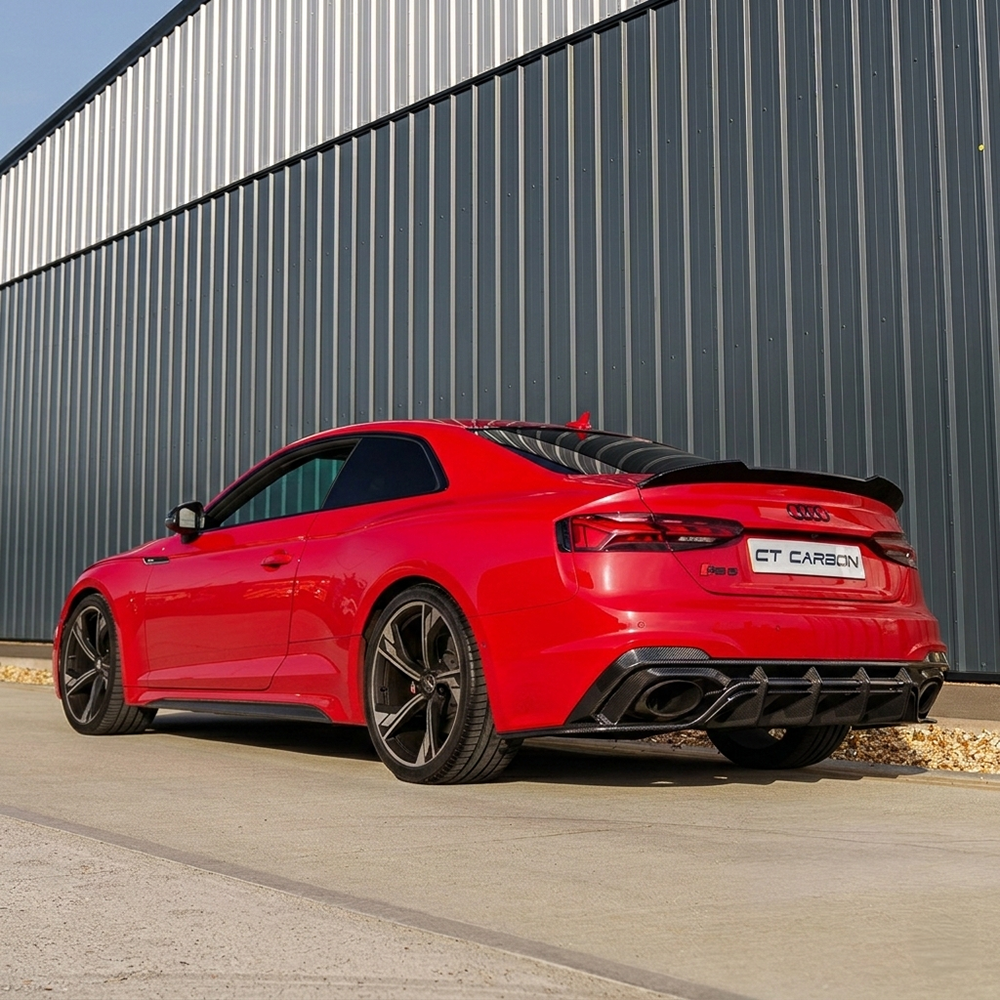Red carbon fiber diffuser for Audi RS5 B9.5 Sportback and coupe, designed by CT Carbon, showcasing sleek aerodynamic styling.