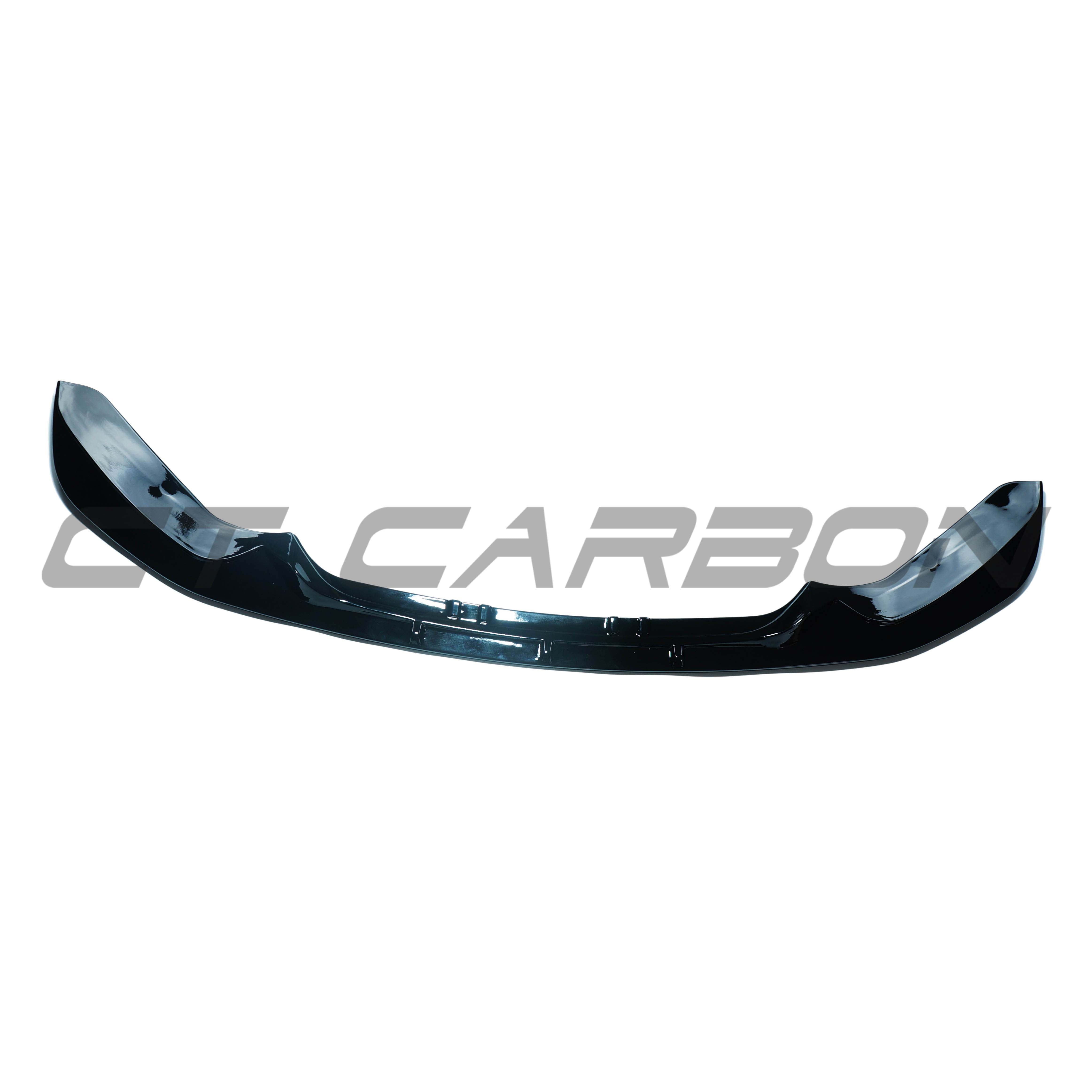 BMW F20/F21 1 Series LCI dual exit gloss black splitter kit by CT Carbon, showing close-up of sleek, aerodynamic car accessory.