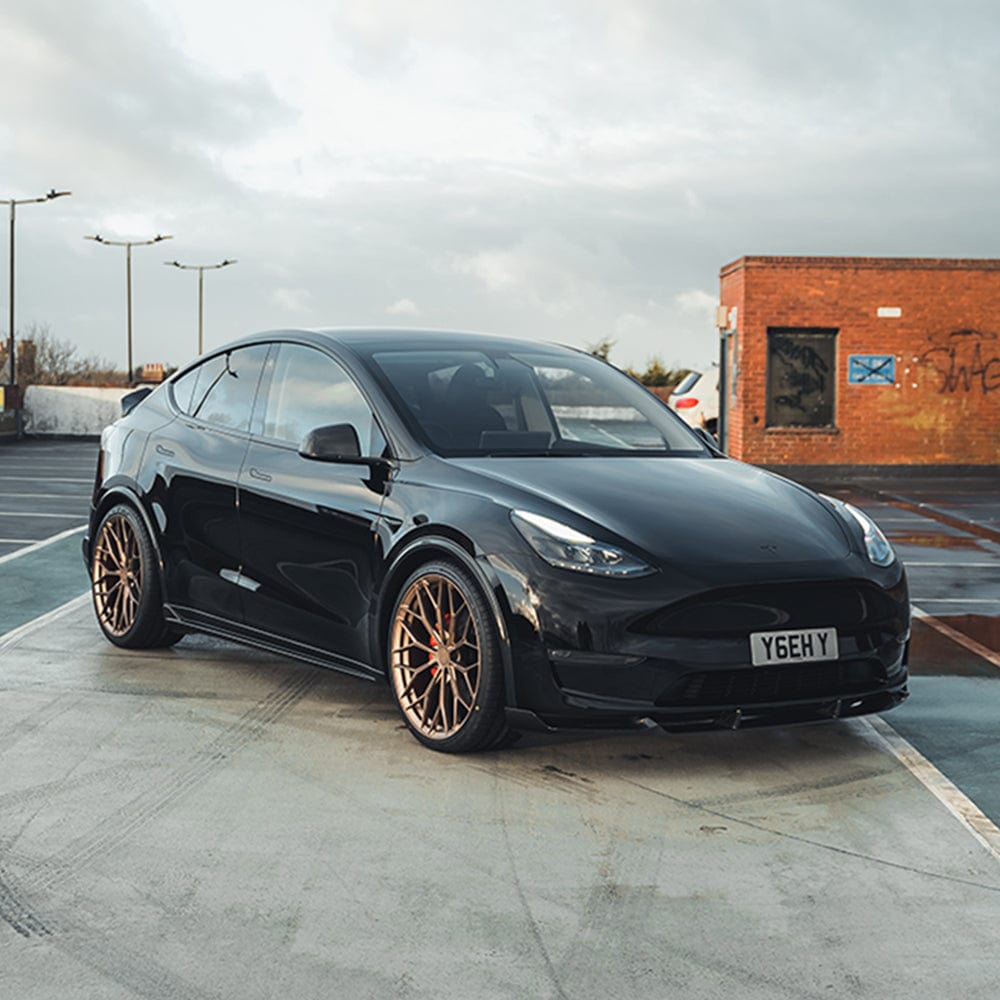 Tesla Model Y MK1 2020-2025 carbon fibre full kit by CT Carbon, showing detailed carbon fibre components on the vehicle.