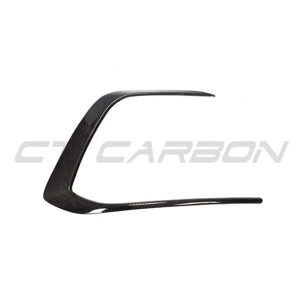 VW Golf MK8 GTI carbon fiber front trim accessory by CT Carbon, showing close-up of sleek, textured black carbon fiber detail.